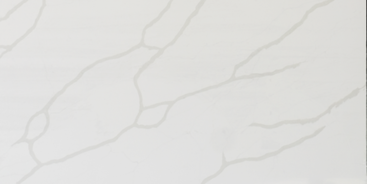 Calacatta Vencac features a clean white background with soft, elongated gray veining that flows gently across the slab, creating a calm, contemporary marble look ideal for modern kitchens, bathrooms, and feature walls.