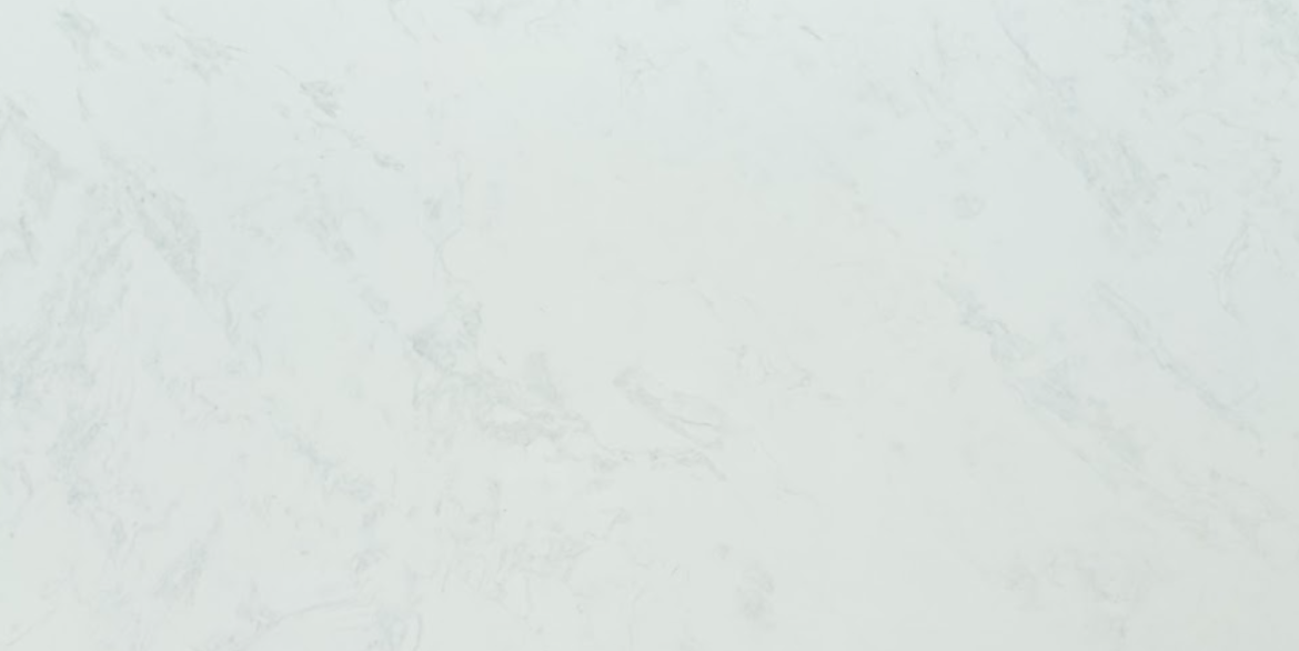 Calacatta Aquamarine quartz slab with soft white background and delicate smoky grey veining for modern kitchen countertops and interior surfaces