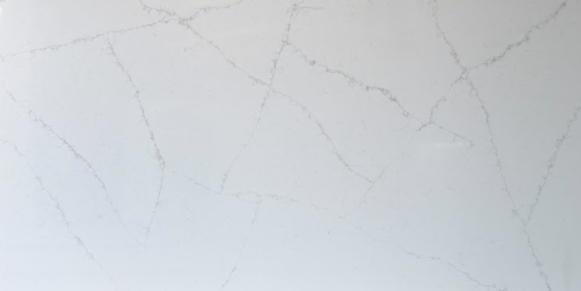 Calacatta Crancy quartz slab with white background and delicate grey veining for modern countertops and kitchen surfaces
