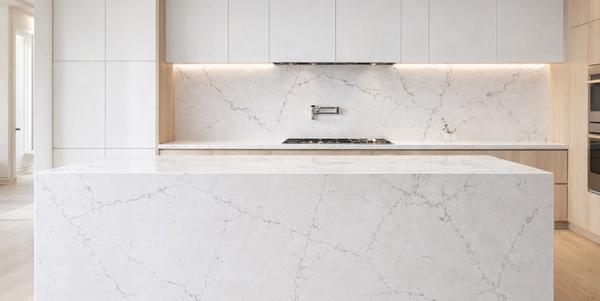 Calacatta Crancy quartz slab with white background and delicate grey veining for modern countertops and kitchen surfaces