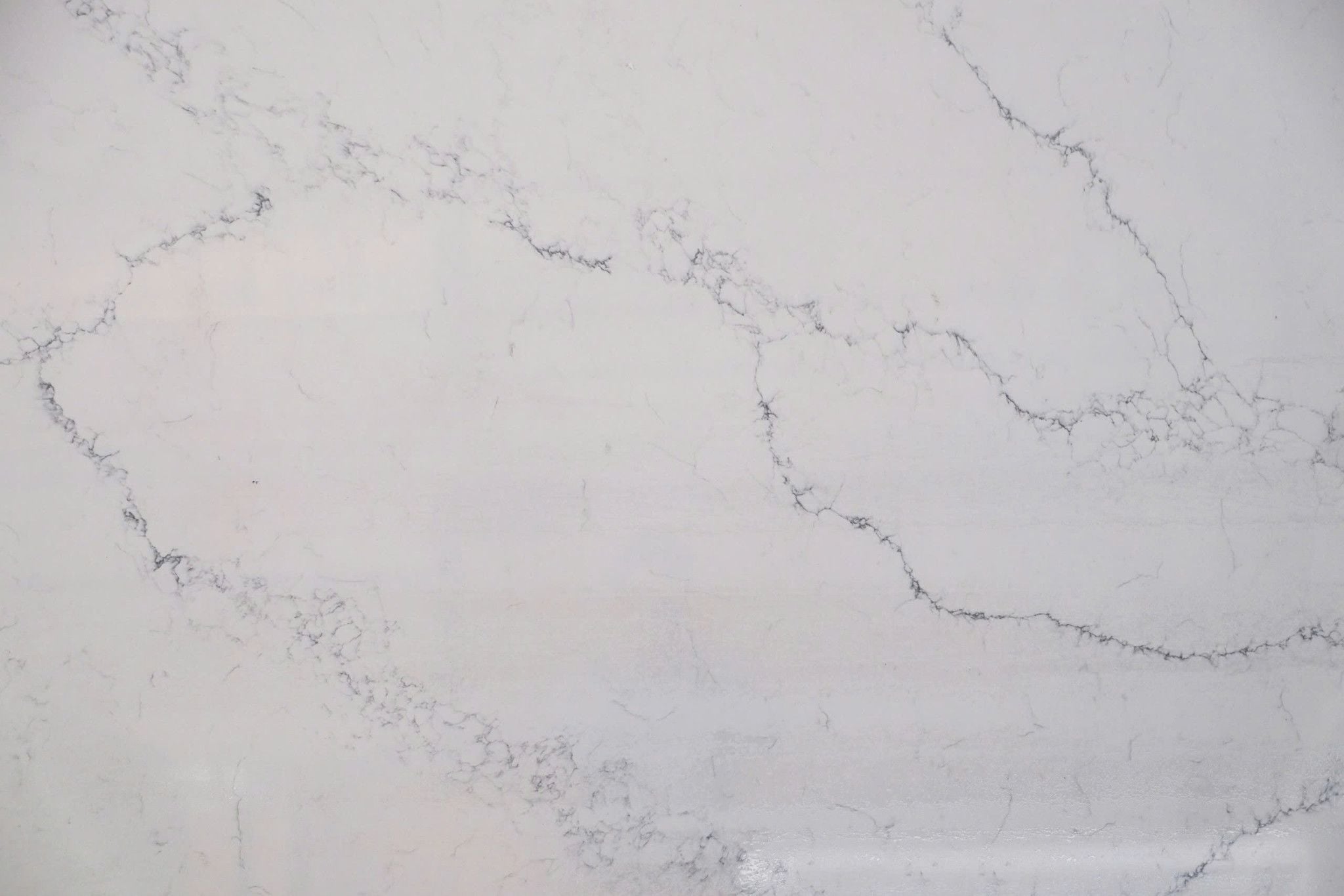 Calacatta Oslo Grey quartz slab with soft flowing beige grey veining