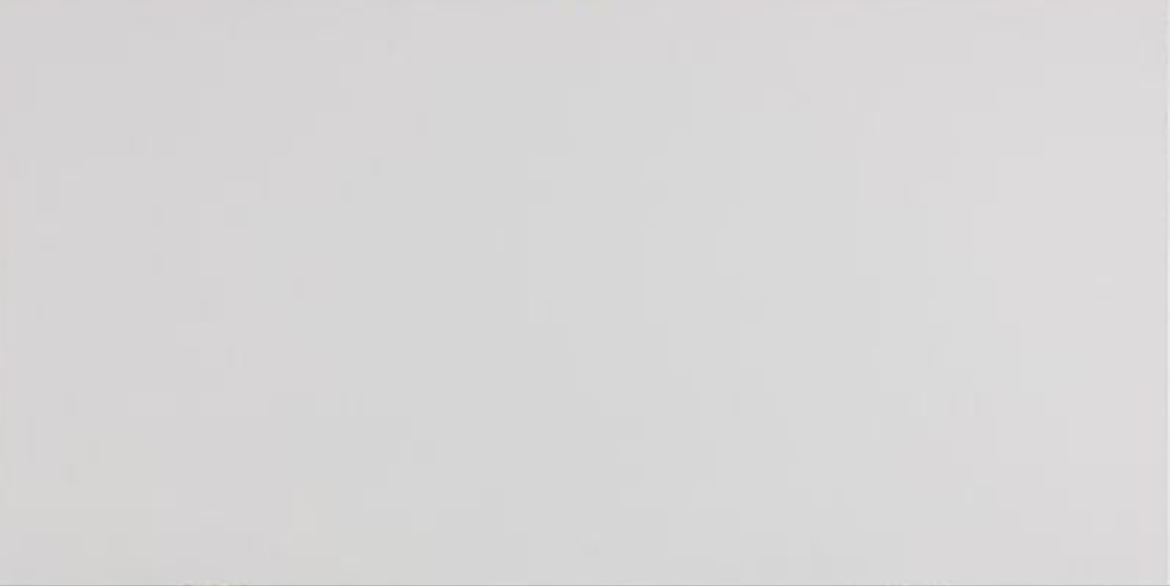 Carrara Flare features a soft white background with delicate, subtle grey wisps that create a clean and understated marble look.