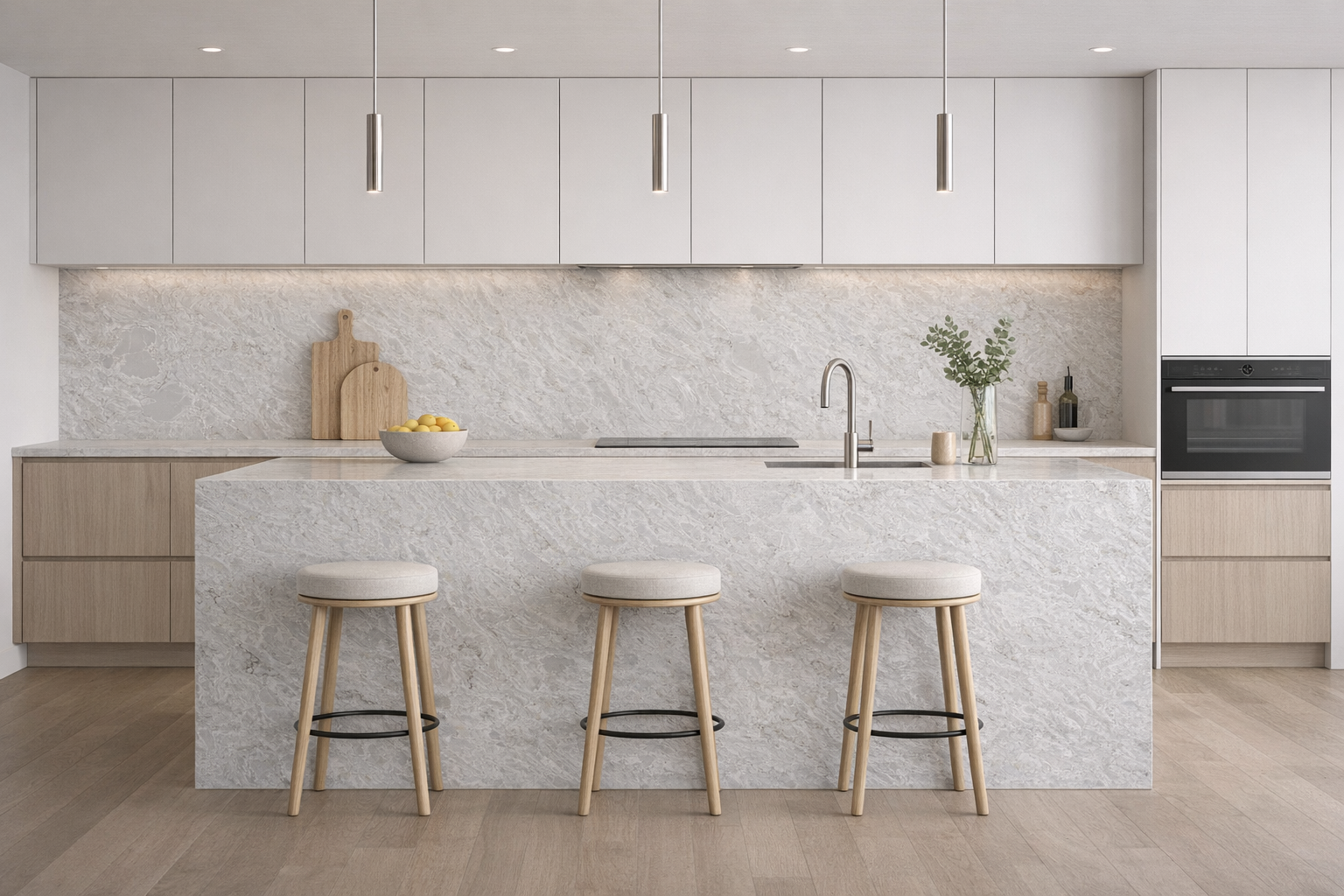 Calacatta Phoenix features a soft white to light grey base with delicate, cloud-like veining that flows gently across the surface, creating a calm and seamless look with subtle depth.