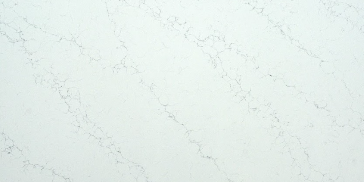 Calacatta Giotto quartz slab with soft white background and delicate crackled grey veining for modern kitchen countertops and interior surfaces