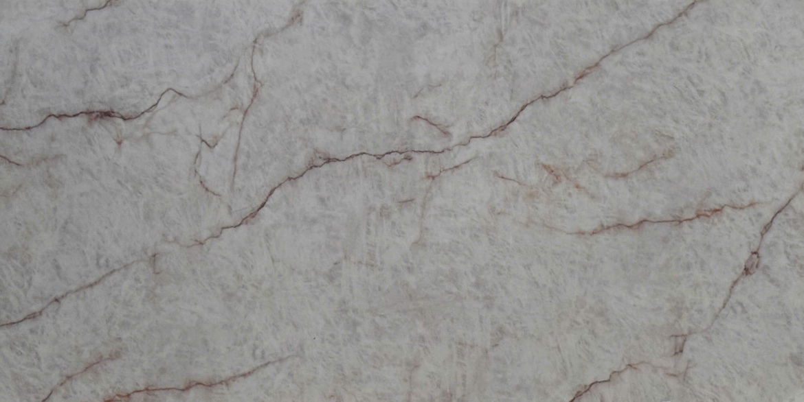 Matterhorn quartz slab with fine reddish-brown veining on a warm beige base.
