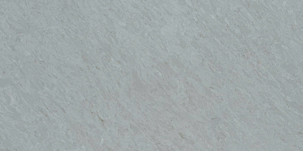 Calacatta Phoenix features a soft white to light grey base with delicate, cloud-like veining that flows gently across the surface, creating a calm and seamless look with subtle depth.