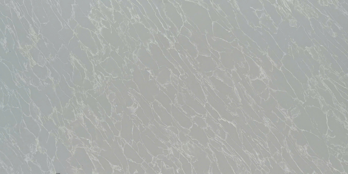 Calacatta Platinum quartz slab with long white veining on a cool light grey base.