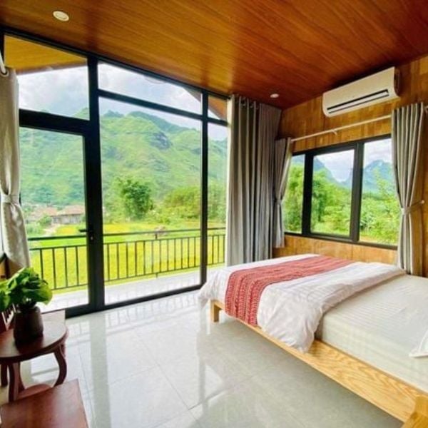Private room with rice field view at Du Gia Field View Homestay for Ha Giang Loop motorbike tour.