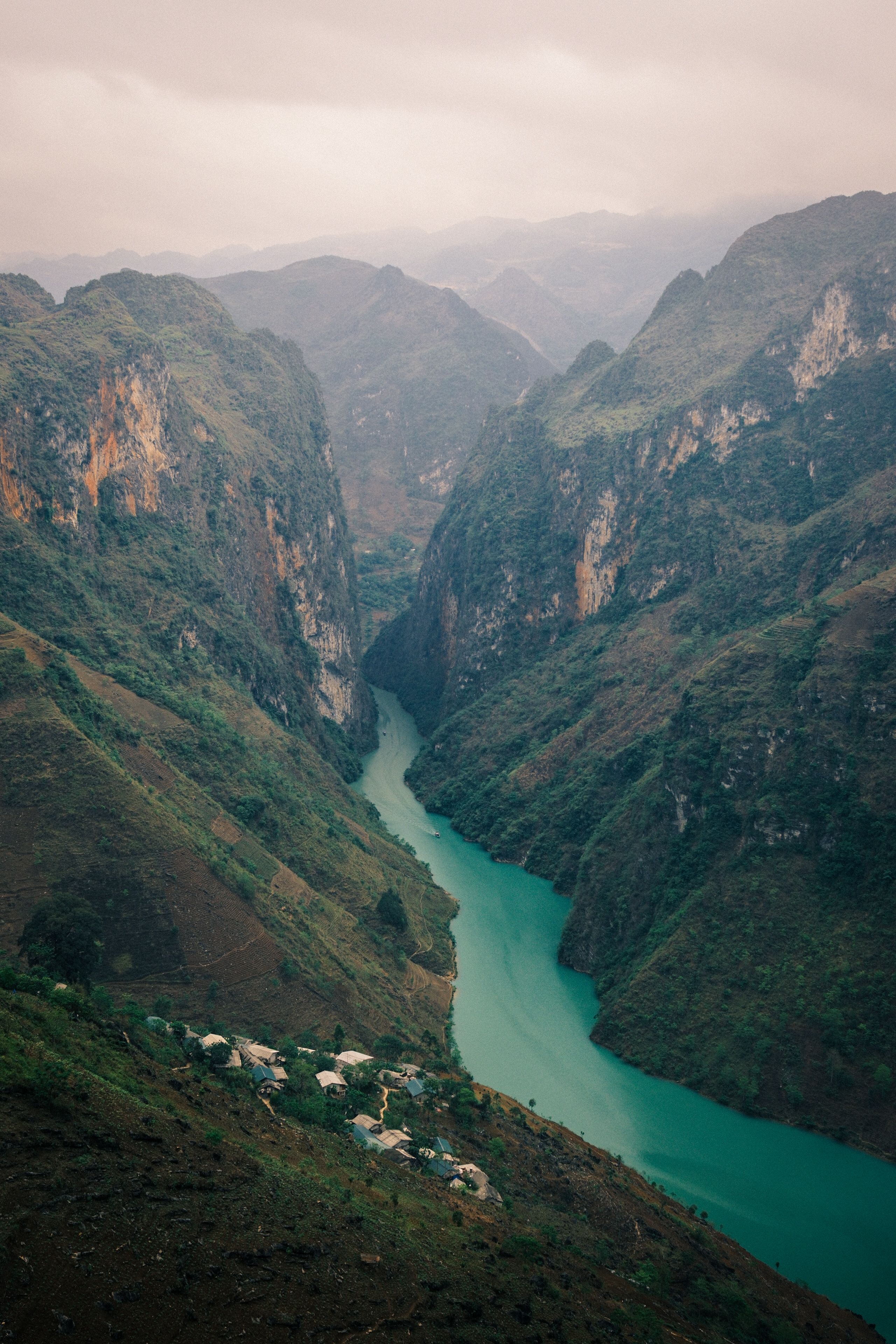 International group of travelers on the Ha Giang Loop at a mountain viewpoint