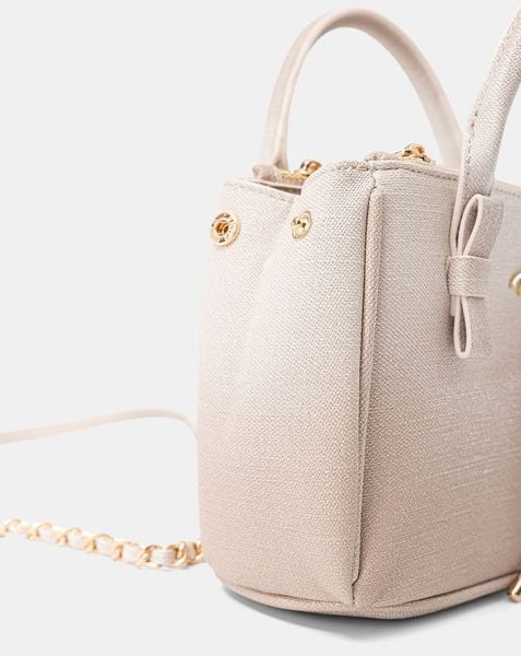  Túi Xách Nhỏ Tay Cầm Nơ Phối Charm 