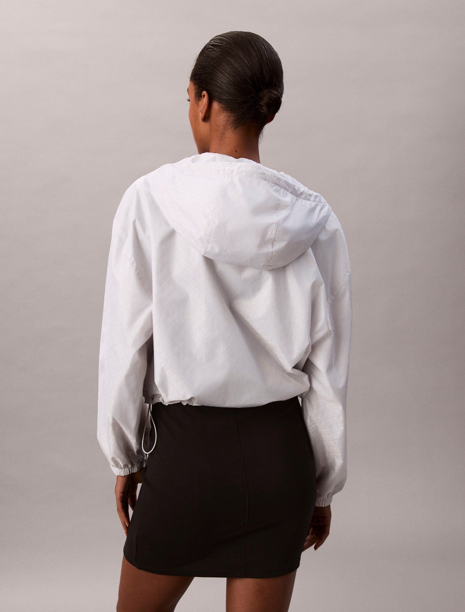 Calvin Klein - Áo khoác gió nữ Emblem Logo Jacquard Wind Jacket