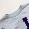 Áo sweater C12 thêu chữ LA ngực Cotton Classic / GHI