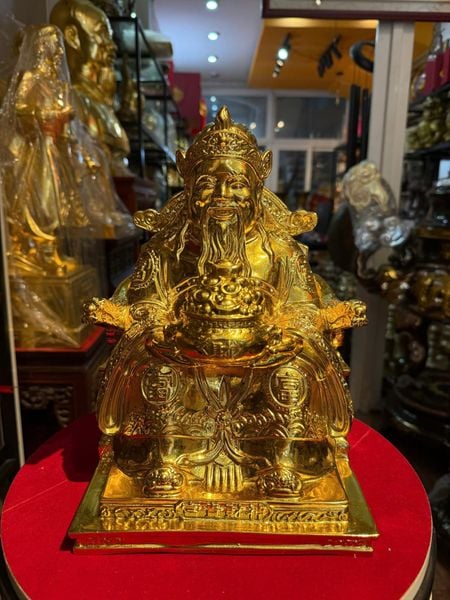 Tượng thần tài dâng tiền