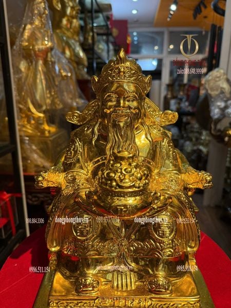 Tượng thần tài dâng tiền