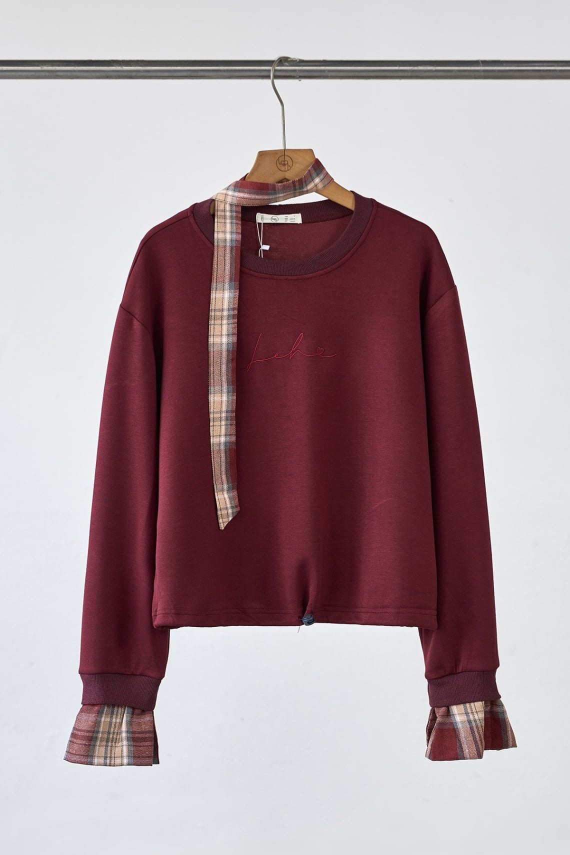 Áo nỉ dáng rộng phối tay rút gấu - H61O25T002