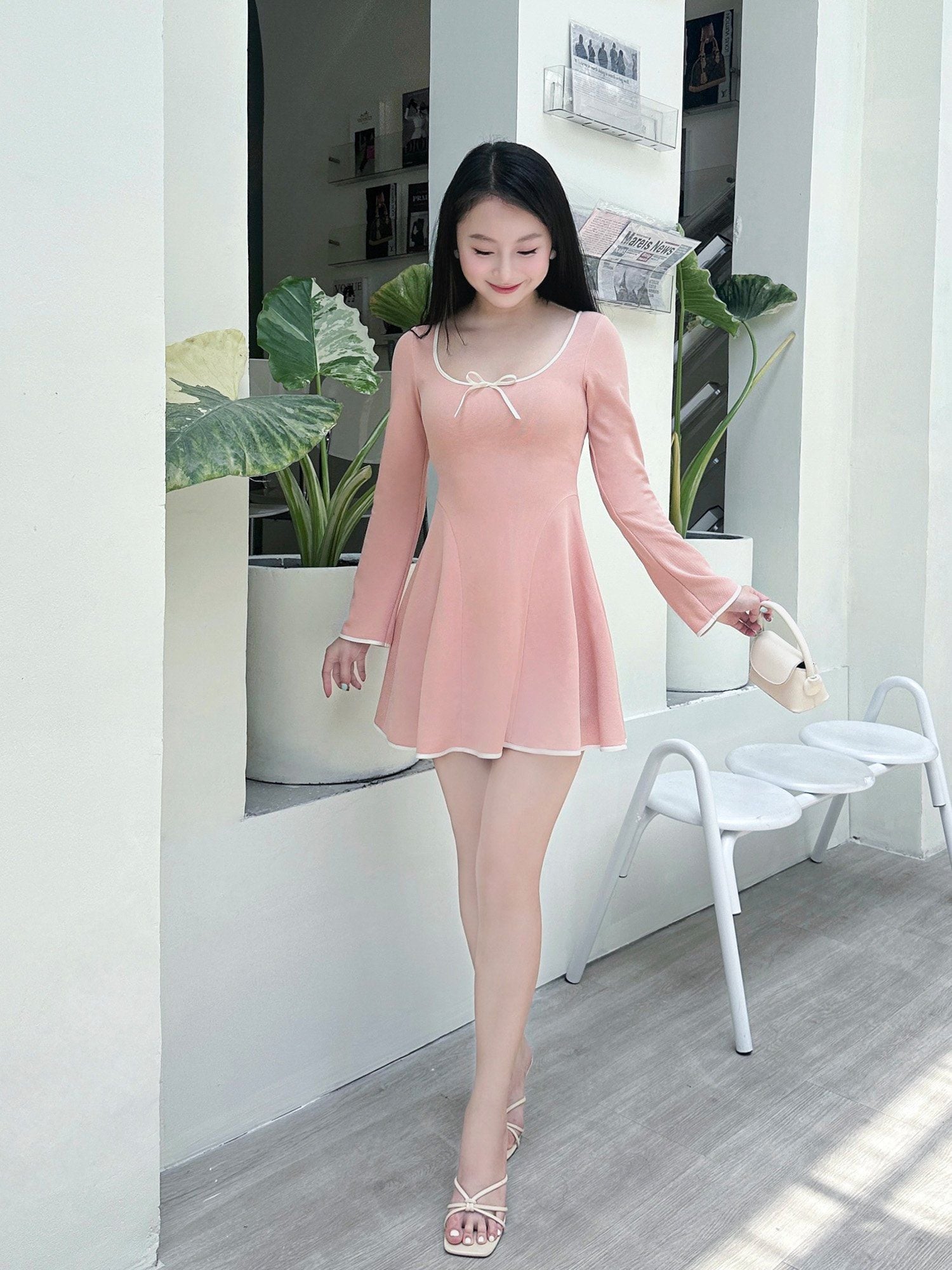  Đầm mini thun tay dài đính nơ 