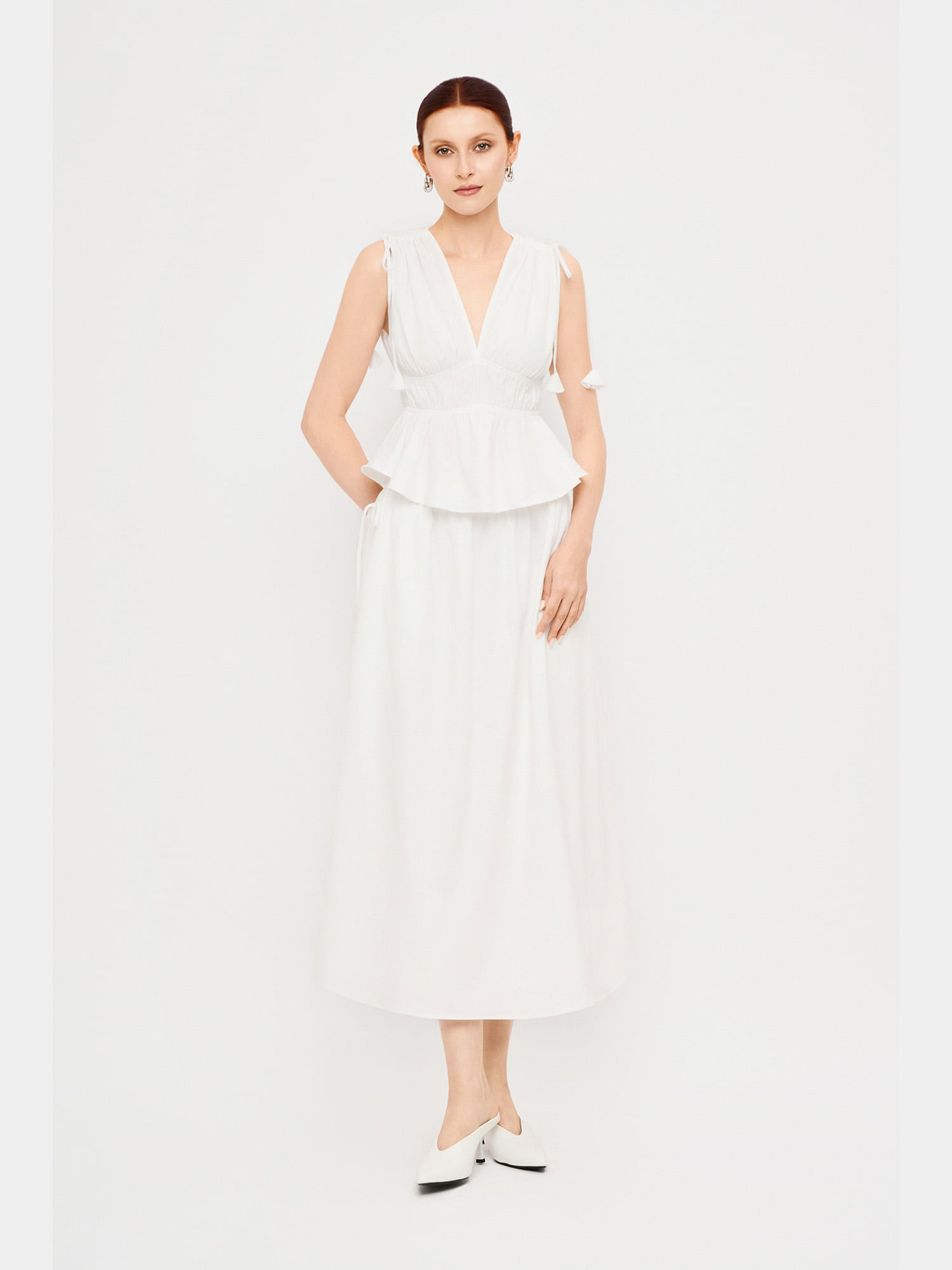 Chân váy dài lưng thun đính nơ hông