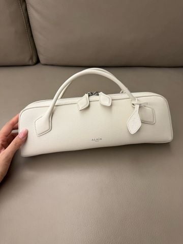 TÚI CẦM TAY NỮ A L LE TECKEL CLUTCH PHOM EAST–WEST KÉO DÀI, DA DÊ VÂN HẠT