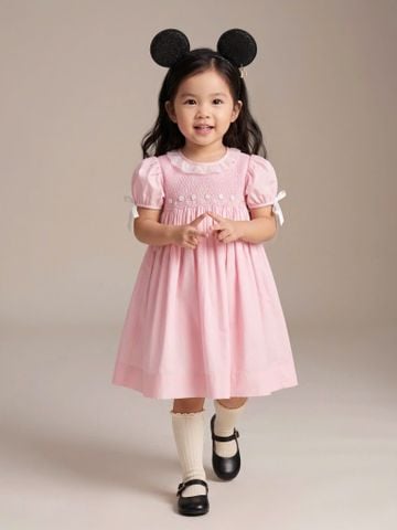  Đầm Smock cổ tròn tay phồng đính nơ 