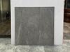 Gạch 60x60 xương đá đồng chất xám đậm