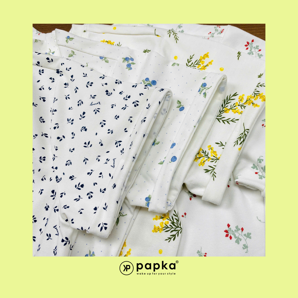 Áo thun nữ Papka 3031 màu trắng họa tiết hoa nhí màu vàng xẻ tà vạt ngắn trước sau mang vẻ trẻ trung thoải mái