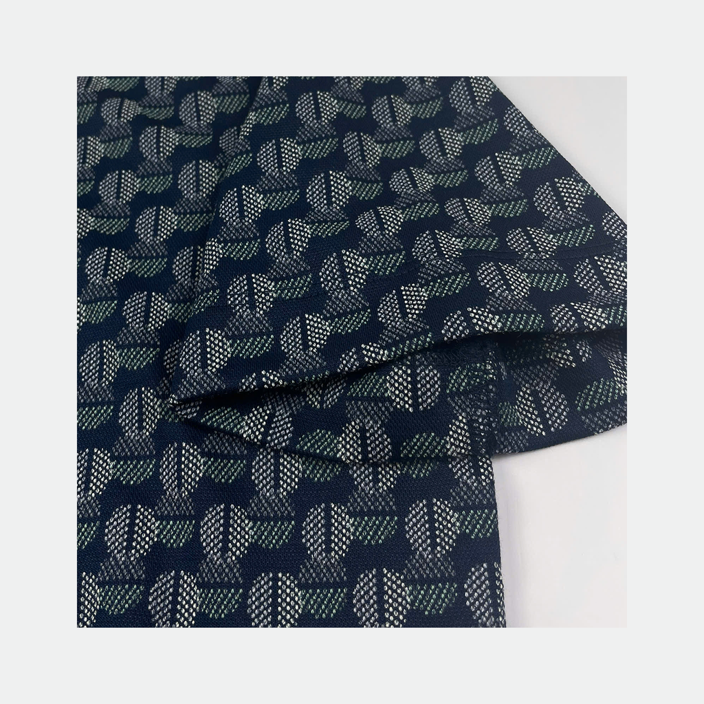 Áo polo nữ Papka 3056 vải Jacquard hoa lá trừu tượng nền xanh navy lạ mắt