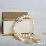  Vòng tay ngọc trai phối charm chữ vạn may mắn 