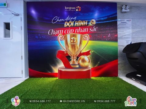 backdrop sự kiện ốp nổi mô hình cúp vàng 3D đi đèn LED hắt sáng rực rỡ chủ đề World Cup tại thẩm mỹ viện Kangnam 
