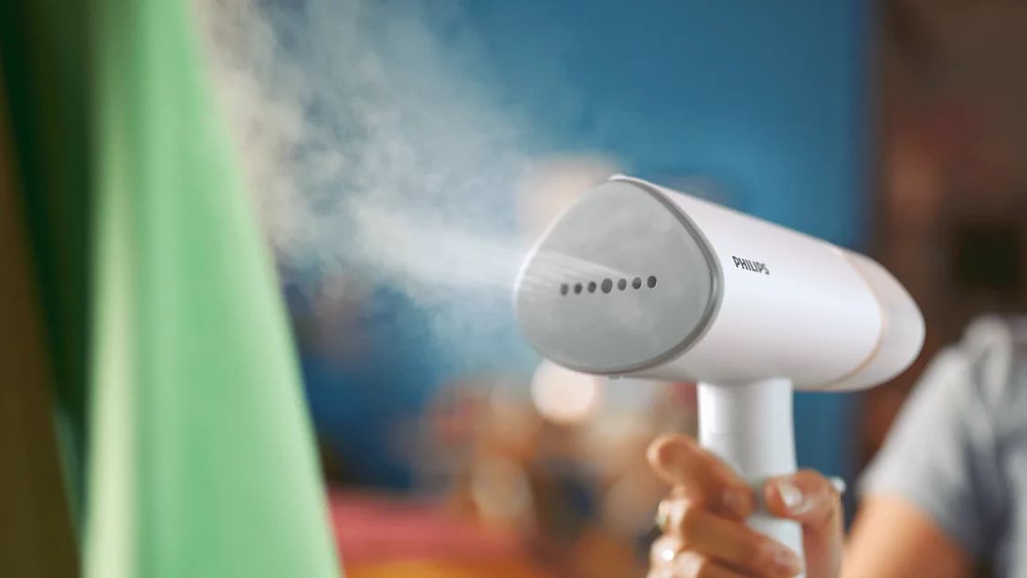 Bàn ủi hơi cầm tay Philips STH3020/10 mặt đế kim loại