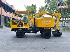 Máy trộn bê tông tự cấp liệu Hồng Hà gầu ghíp