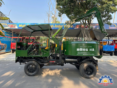 Xe trộn bê tông tự cấp liệu 12 bao 2 cầu Hồng Hà