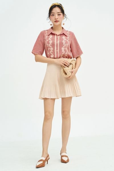 Chân váy mini xốp kem dập ly random