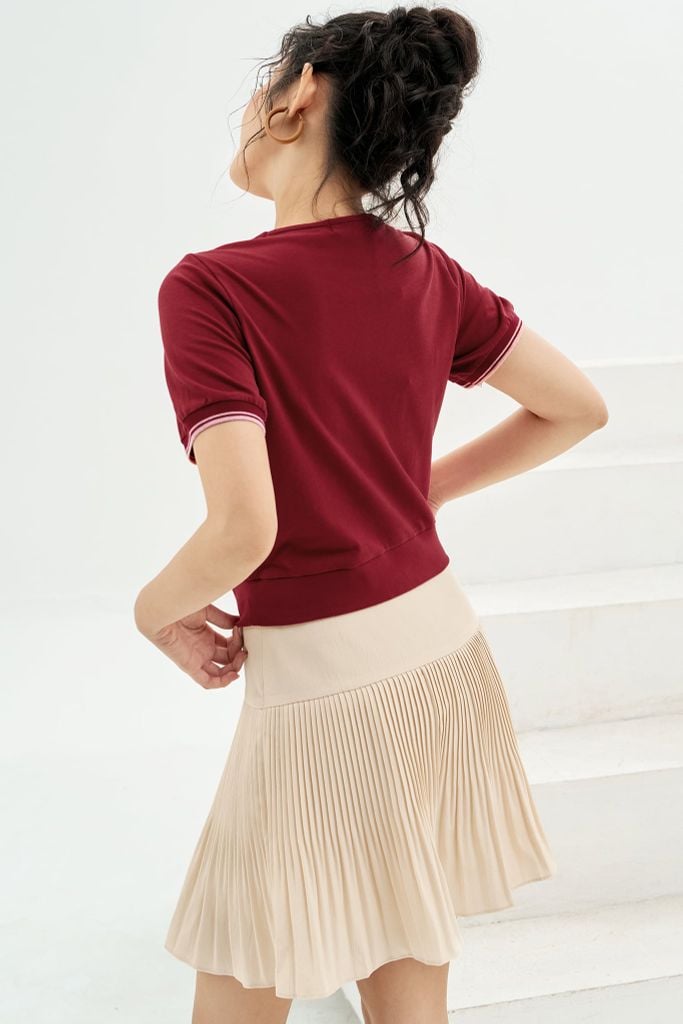 Chân váy mini xốp kem dập ly random