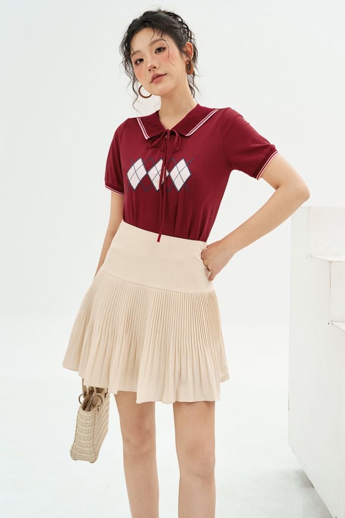 Chân váy mini xốp kem dập ly random