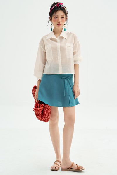 Chân váy mini xoè poly xốp xanh đính nơ