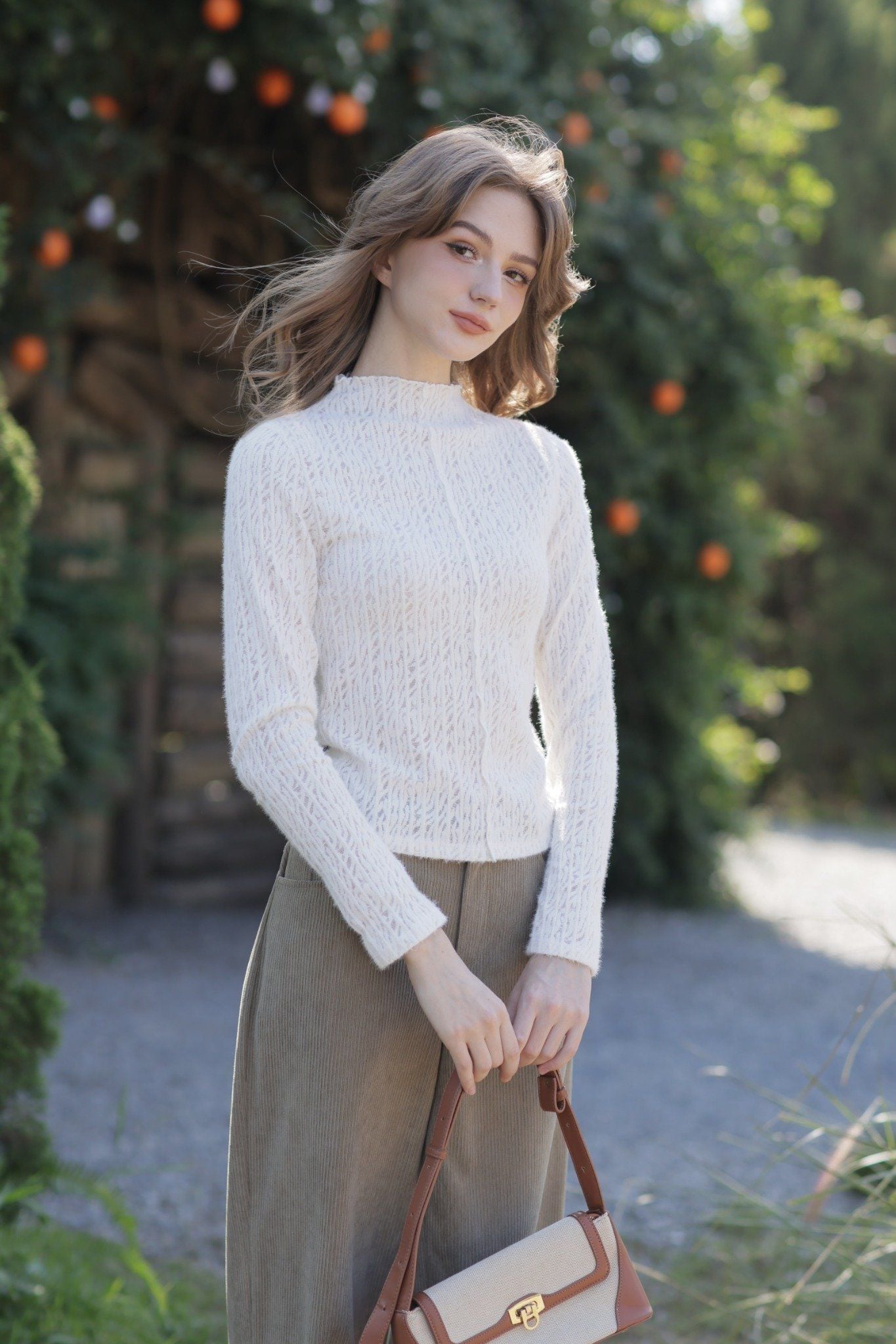 Top dài tay thun lưới kem cổ leo