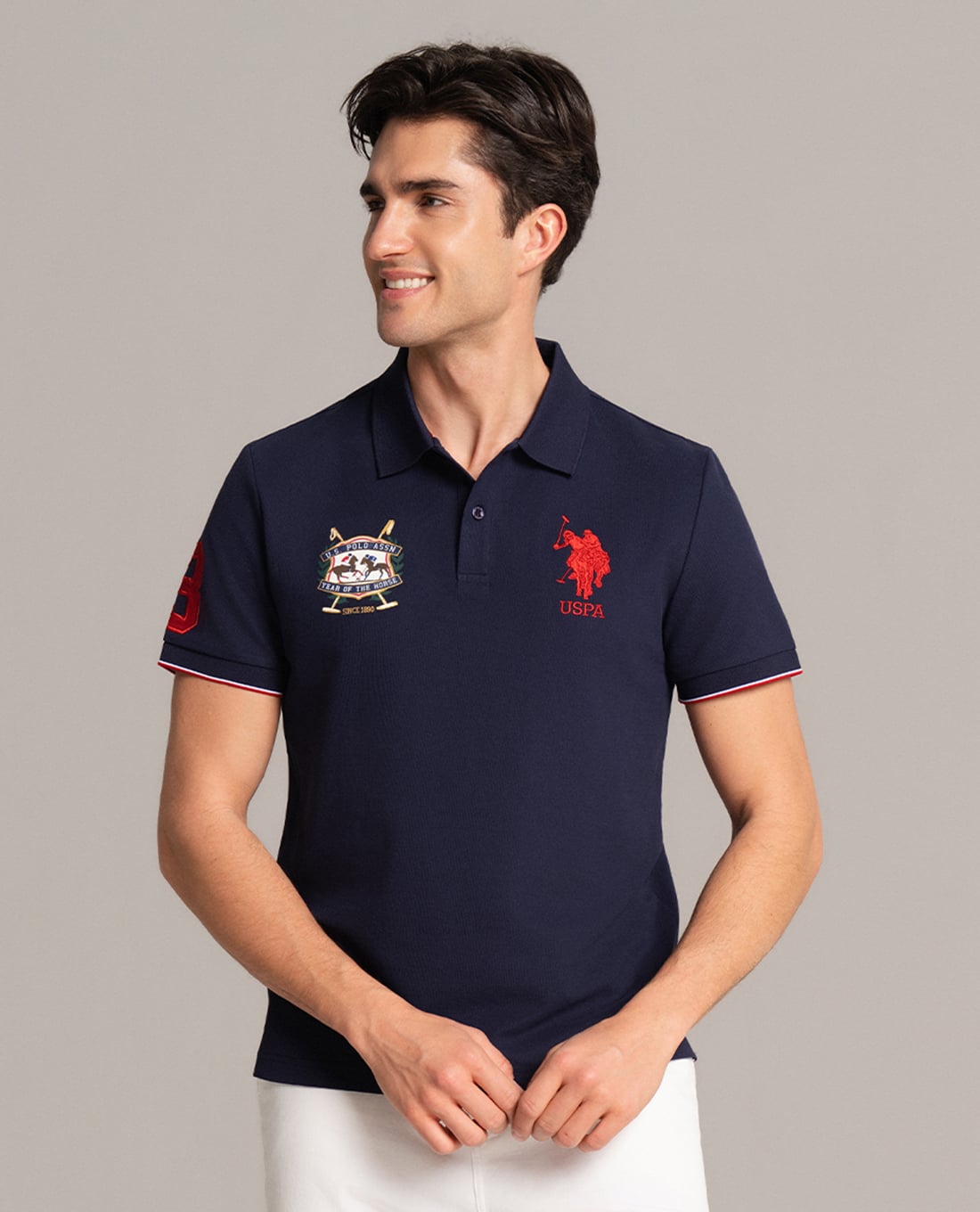 USPA - Áo polo nam cổ bẻ tay ngắn phối viền thêu logo