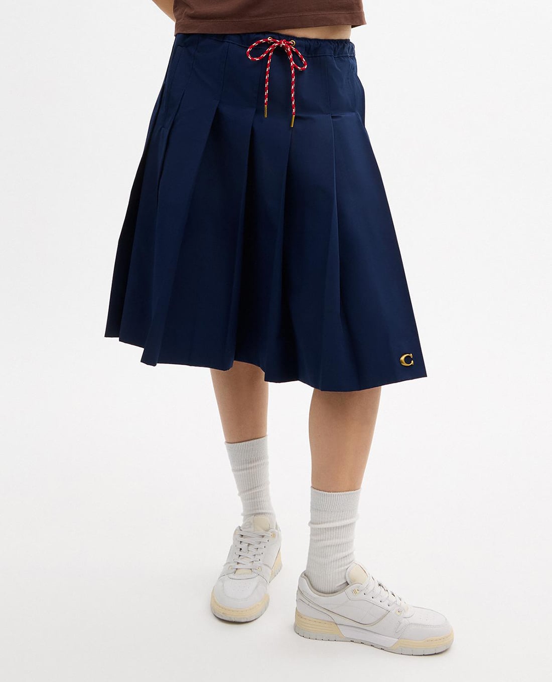 COACH - Chân váy xếp li midi Sporty