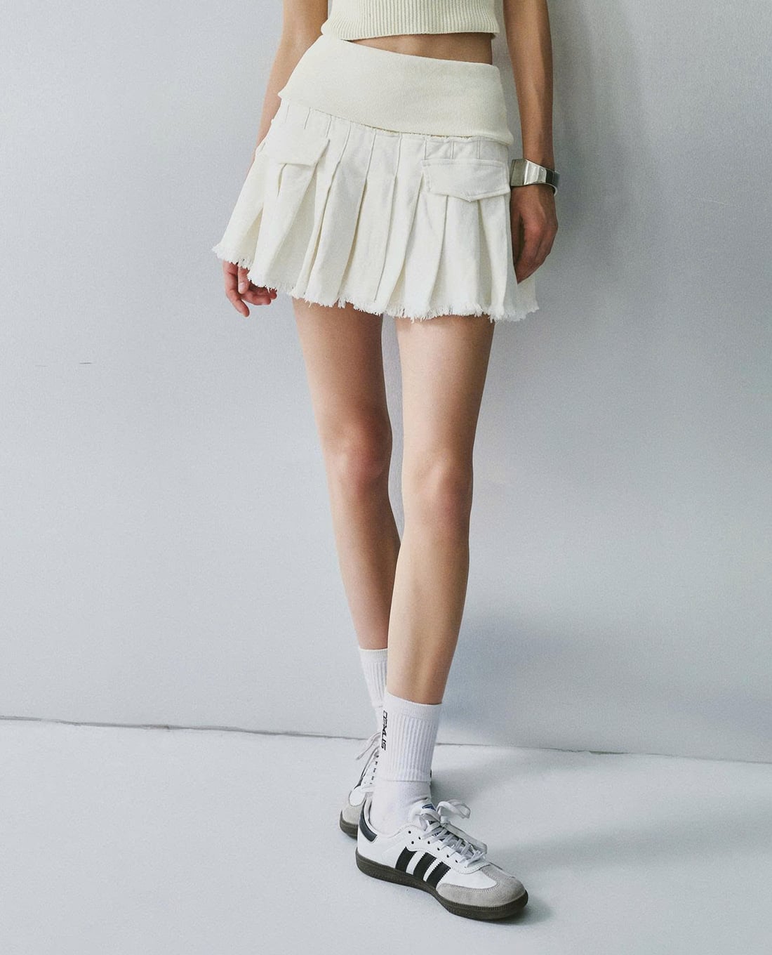 DEZUS - Chân váy xếp li mini phối túi hộp Otis