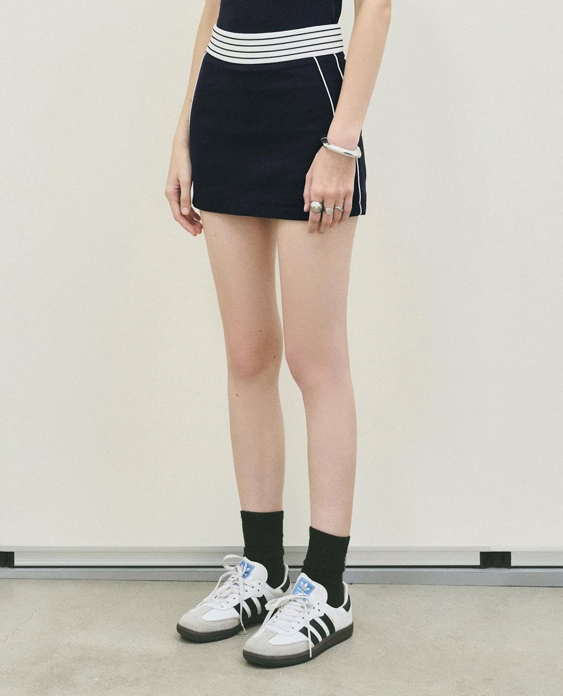 DEZUS - Chân váy chữ A mini viền sọc Tasan