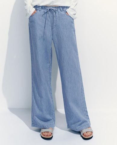  URBAN REVIVO - Quần jeans nữ ống rộng lưng thun phối dây rút 