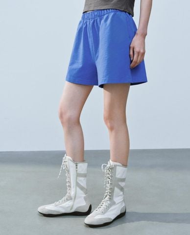  URBAN REVIVO - Quần short nữ ống rộng lưng thun 