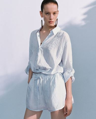  URBAN REVIVO - Áo sơ mi nữ cổ bẻ tay dài xoắn eo 