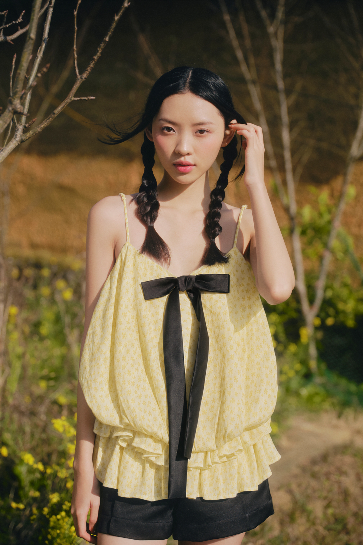 Áo 2 dây đính nơ Cream Dot Bow Ruffle Puff Cami Top