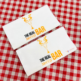 


																	 Khăn giấy ăn in logo THE REAL BAR 