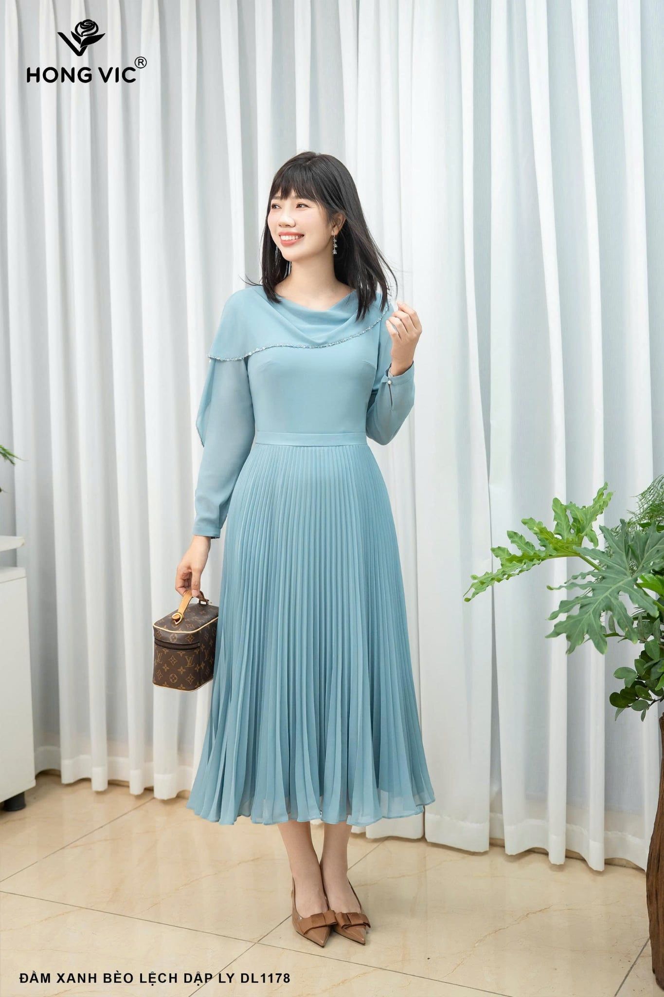 Đầm xanh bèo lệch dập ly DL1178