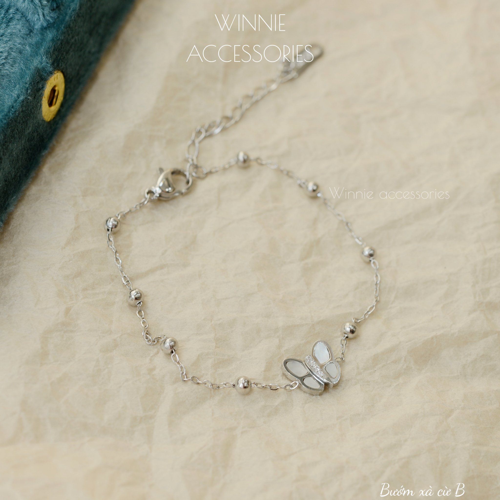  Lắc tay Titan Bướm xà cừ B 