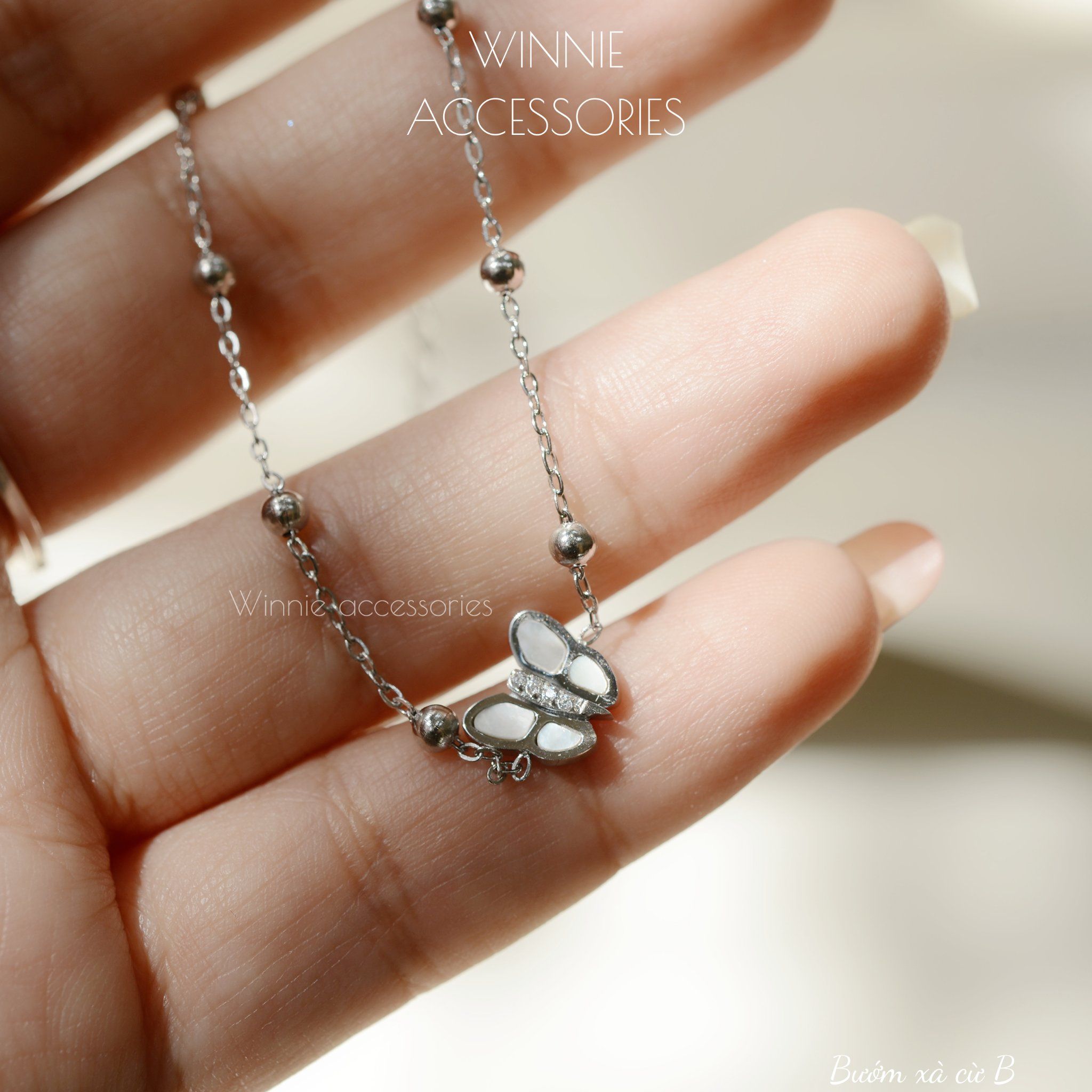  Lắc tay Titan Bướm xà cừ B 