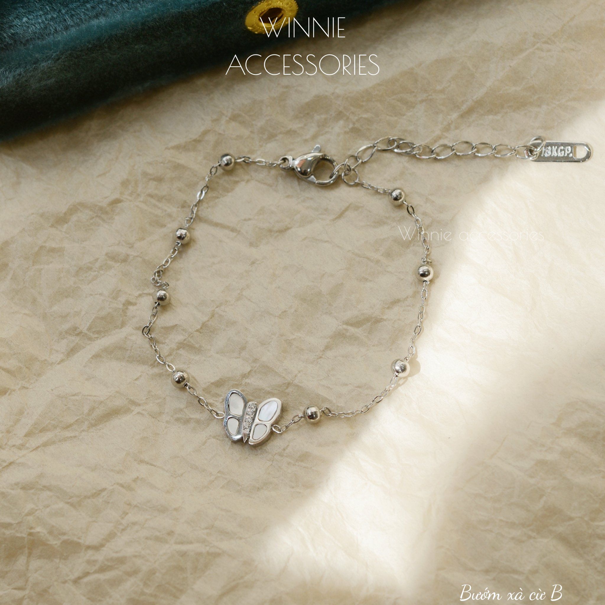  Lắc tay Titan Bướm xà cừ B 