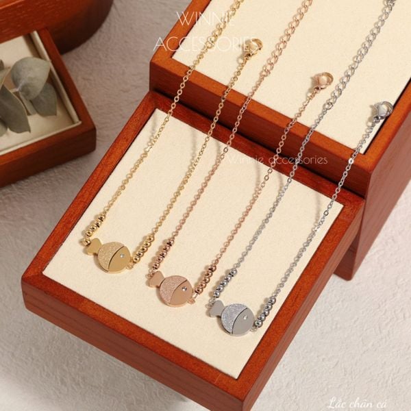  Lắc chân titan Cá 